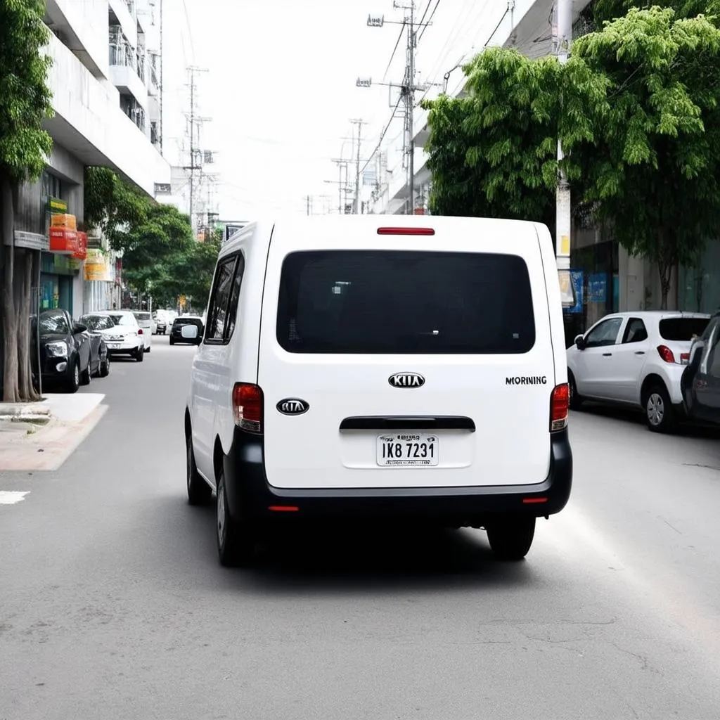 Kia Morning Van 2017 màu trắng đang dừng giao hàng