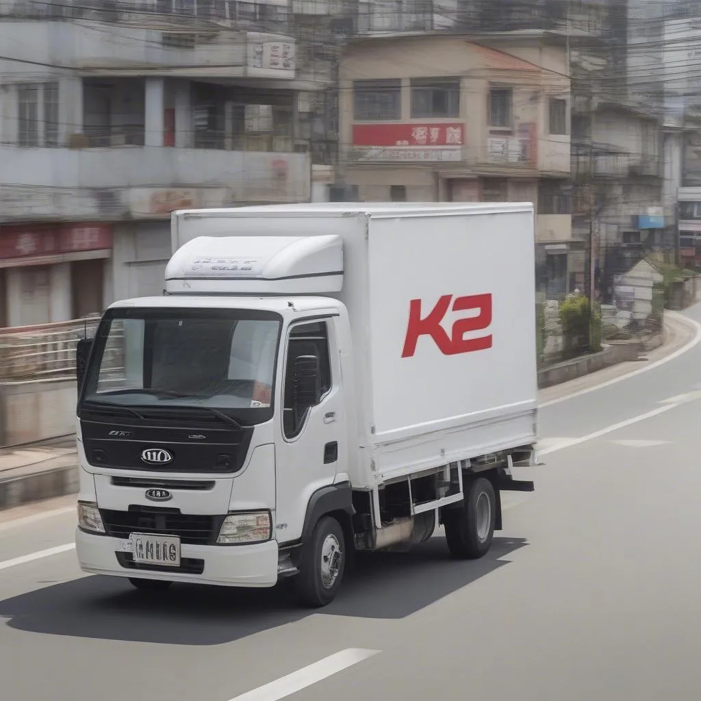 xe tải kia k200 màu trắng đang chạy trên đường